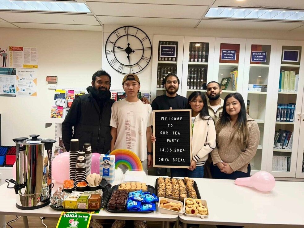 Student Posing in front of their table ready for tea party